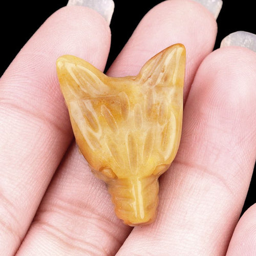 Hand-carved wolf head figurine made of natural amethyst, rose quartz, and tiger's eye—small animal ornament.