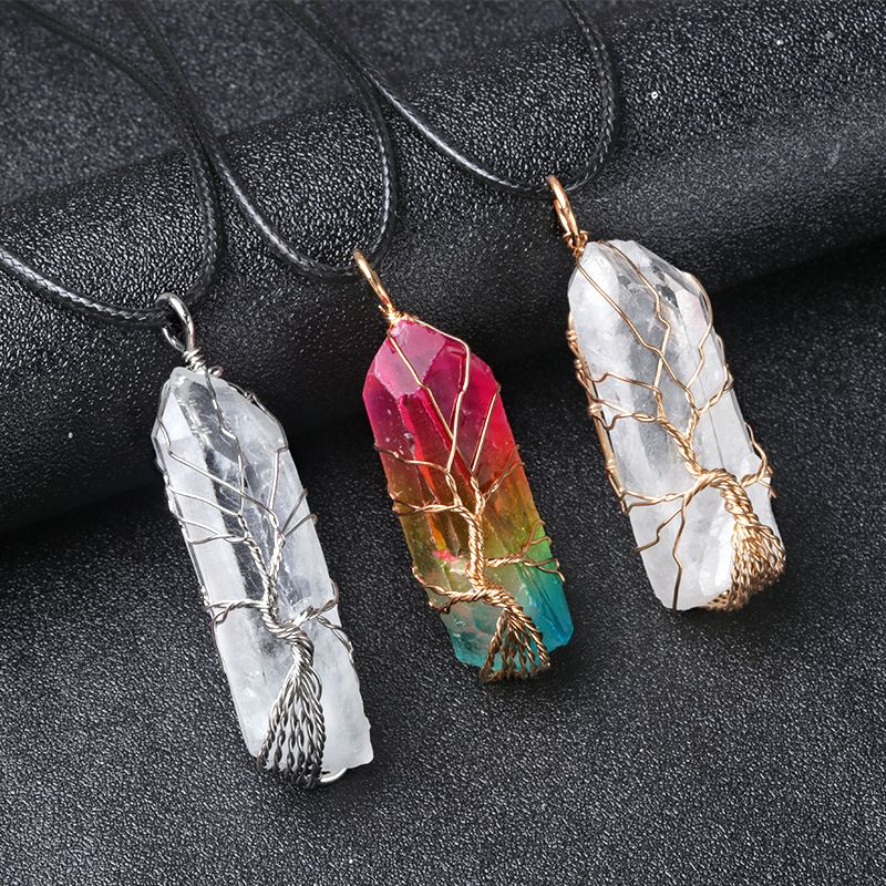 Wire-wrapped natural white quartz crystal point "Tree of Life" pendant with an iridescent electroplated finish.