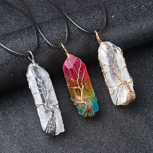 Wire-wrapped natural white quartz crystal point "Tree of Life" pendant with an iridescent electroplated finish.